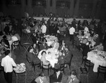 Shriners and a group in a dining room by W. D. Smith