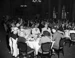 Shriners and a group in a dining room by W. D. Smith