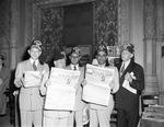 Shriners in a dining room holding newspapers by W. D. Smith