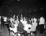 Shriners and a group in a dining room by W. D. Smith