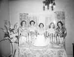 Wedding guests posing by wedding cake by W. D. Smith