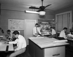 Five employees working in Charlie Armstrong's Offices by W. D. Smith