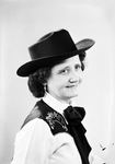 Half-length portrait photograph of a woman in western attire by W. D. Smith