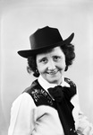 Half-length portrait photograph of a woman in western attire by W. D. Smith