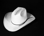 A straw cowboy hat with a cattleman crown by W. D. Smith