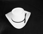 A straw cowboy hat with a flat brim and long crown by W. D. Smith