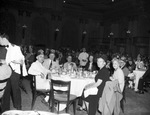 Group in a dining room by W. D. Smith