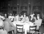 Group in a dining room by W. D. Smith