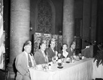 Group with Shriners in a dining room and seated at a speakers' table by W. D. Smith