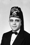 Portrait of Abe Mehl wearing a drum corps fez by W. D. Smith