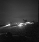 Night view of spectators in the Los Angeles Memorial Coliseum by W. D. Smith