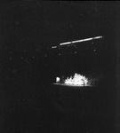 A night view of a float in a parade in the Los Angeles Memorial Colliseum by W. D. Smith