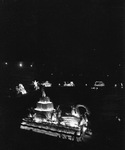 A night view a Shriners parade at the Los Angeles Colliseum by W. D. Smith