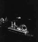 A night view a Shriners parade at the Los Angeles Colliseum by W. D. Smith