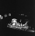 A night view a Shriners parade at the Los Angeles Colliseum by W. D. Smith