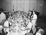 Arabia Temple Chanters at dining tables by W. D. Smith