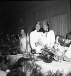 Moslah Potentate with dinner guests by W. D. Smith