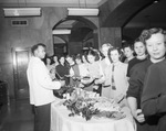 Employees at a Christmas party by W. D. Smith