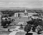 Birds-eye-view of several buildings and montains in the distance by W. D. Smith