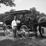 Moslah Drum Corps with horse-drawn carriage by W. D. Smith