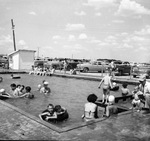 Bank employees at picnic, swimming pool by W. D. Smith