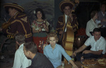 Mariachi band playing to group of people by W. D. Smith