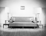 Leather sofa with endtables and lamps by W. D. Smith