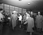 Roy Rogers being greeted by a crowd at the airport by W. D. Smith