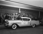 Roy Rogers and crowd standing next to Courtesy Chevrolet by W. D. Smith