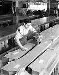 Man using cloth cutter at Williamson Dickie Manufacturing Company by W. D. Smith