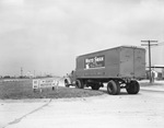 Truck of Waples Platter Grocery Company advertising White Swan Fine Foods on the side by W. D. Smith