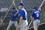 baseball player watching game by University Photographer