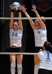 Mavericks Volleyball Team at Net by University Photographer