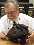 Professor with frog by University Photographer