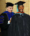 Student at graduation ceremony by University Photographer