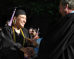 Student at graduation ceremony by University Photographer