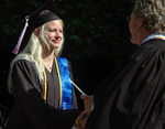 Student at graduation ceremony by University Photographer