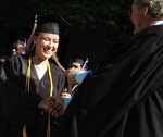 Student at graduation ceremony by University Photographer