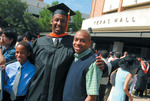 Student at graduation ceremony by University Photographer