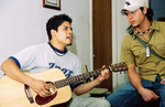 Student Playing Guitar by University Photographer