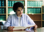 Student Reading Book by University Photographer