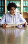 Student Reading Book by University Photographer