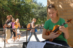 Student Reviewing Sheet Music by University Photographer