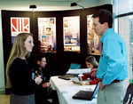 Student Speaking to Architecture Representative by University Photographer