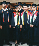 Students at graduation ceremony by University Photographer