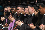 Students at graduation ceremony by University Photographer