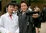 Students at graduation ceremony by University Photographer