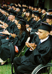 Students at graduation ceremony by University Photographer