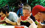 Students Eating Watermelon by University Photographer