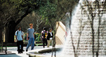 Students Walking By Fountain by University Photographer